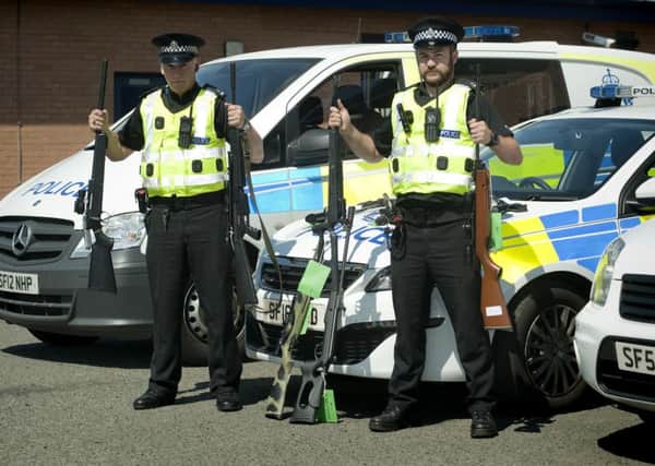 08-06-2016 Picture Roberto Cavieres.   KIRKINTILLOCH police office air weapons campaign, PC Alan Muir and Greg Cameron