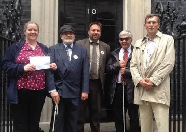 Campaigners outside the door to 10 Downing Street.
