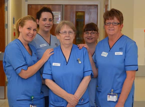 Margaret Russell BEM
 (centre) with ward 17 colleagues (from left) staff nurse Joanne Bell, clinical support worker Yvonne Blyth, clinical support worker Teresa McCluskey, charge nurse Sylvia Mcluckie