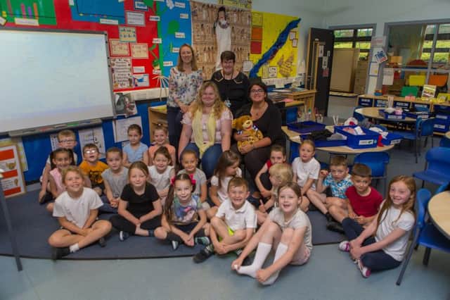 Laure Marcadier (16) from Bruge is visiting Kennoway Primary School as part of the Twinning Association event. Pictured with Abby Staig (19) who she is staying with until Tuesday. Here they meet kids from Kennoway Primary Class P2b with teacher Lorna McKay and Pupil Support Mrs Strang