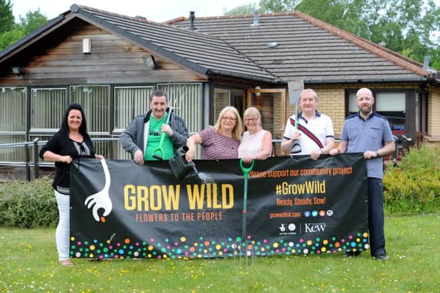 Karen Pettigrew, Robert McCarte, Kate Keltie, Marilyn Walker, Campbell Moore and Stephen O'Neill at the new Loretto Care community garden in Wishaw