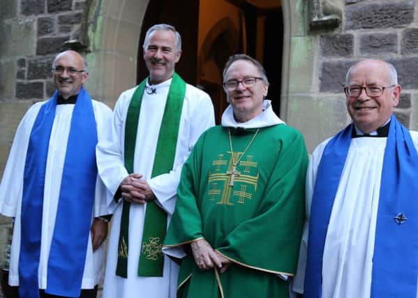 Canon Drew Sheridan, (second left)  Bishop Gregor Duncan and Christ Churchs Lay Readers Bobby Burgon and Richard Evans after the institution.