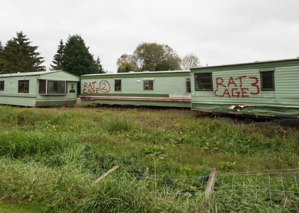 On a separate occasion caravans labelled 'rat cages' appeared on the site