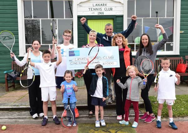 Lanark Tennis Club celebrates receiving the grant