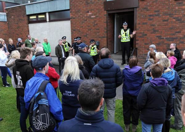 Chief Inspector David Bruce speaks to volunteers before they set off from St Lucy's Church. Picture by Alan Watson
