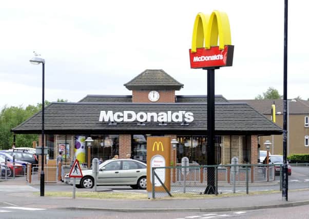Robber threatened McDonalds staff with a knife in the early hours.
