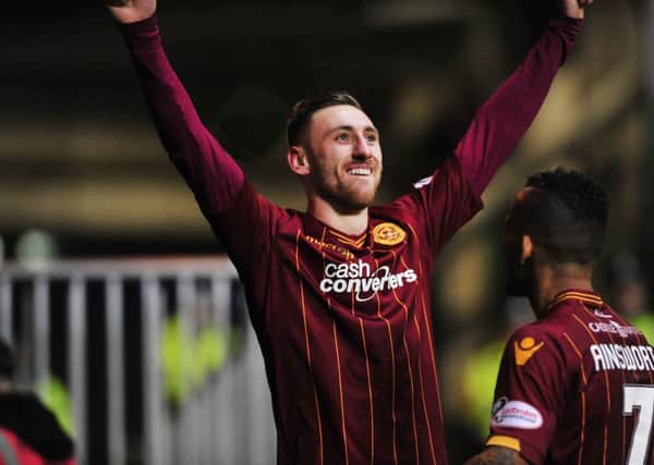 Louis Moult celebrates scoring against Celtic in the 2-1 win at Parkhead last December (Pic by Alan Murray)