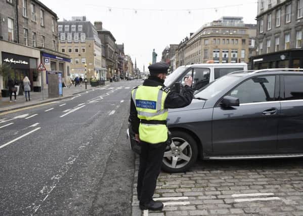 Parking attendants are a common sight on the streets of Edinburgh and could be returning to North Lanarkshire
