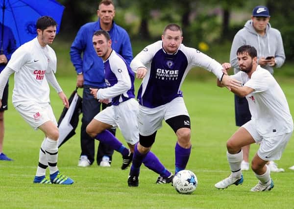 Willie Sawyers takes on the Camelon defence