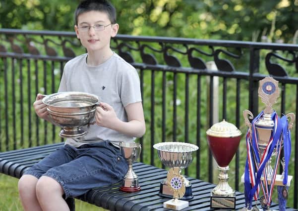 Photo Emma Mitchell 01.08.16
Graham Law highland dancer with his trophies.