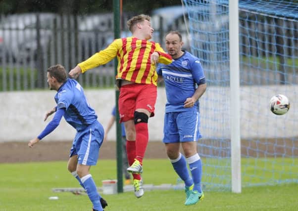 Rossvale's Colin Preston tries to put pressure on the Kilsyth defence
