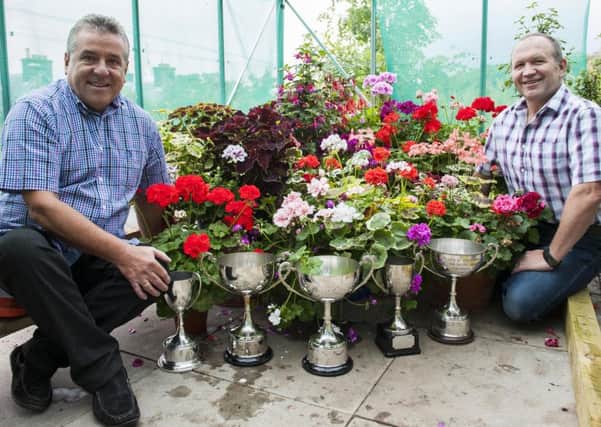 Tom Kirkland (left) with his partner Robert Barclay, and the trophies he won at Ayr Flower Show ( Picture Sarah Peters).