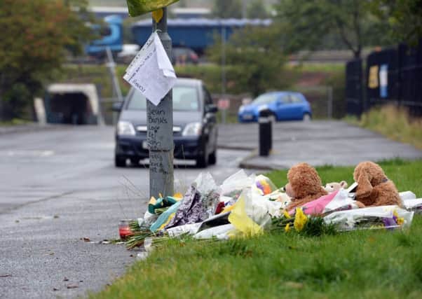 Tributes at the scene  in North British Road, Uddingston, were Sean Banks was stabbed.