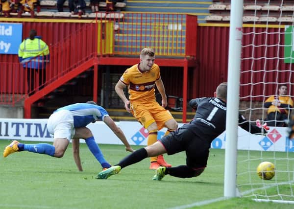 Chris Cadden puts Motherwell ahead against St Johnstone on Saturday (Pic by Alan Watson)