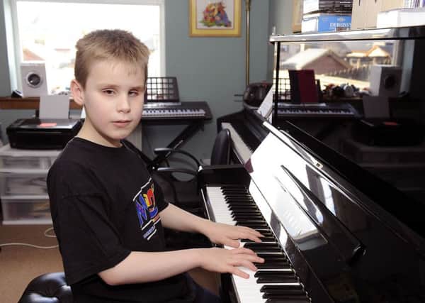 Ethan Loch (11) award-winning blind pianist. (Picture by Michael Gillen)
