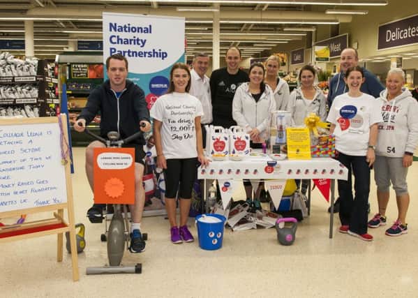 Leona Baille (standing, left) is  fundraising by doing a Charity Skydive, with the backing of fellow Tesco workers (Picture Sarah Peters)