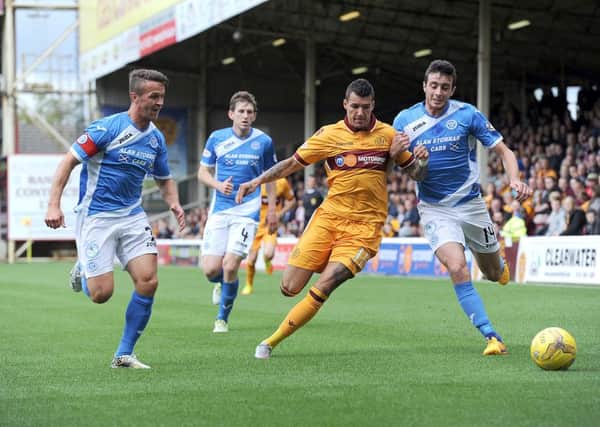 Marvin Johnson, pictured playing for Motherwell against St Johnstone, has been linked with a move away from Fir Park (Pic by Alan Watson)
