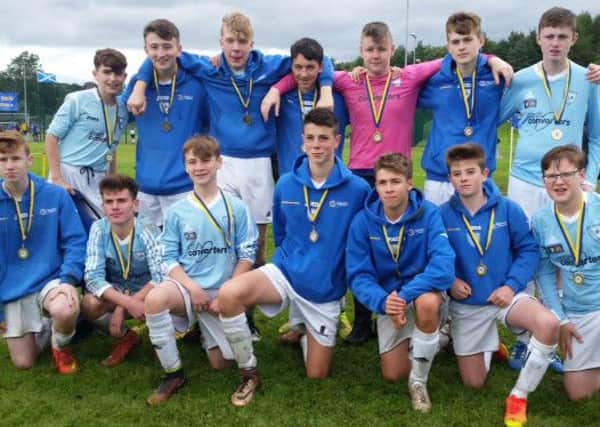 Lenzie YC under-16s with their medals after losing out to Milton Rovers in the Cumbernauld Colts Festival final