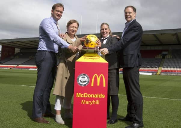 Launching Partick Thistle's community champions scheme are managing director Ian Maxwell, Cimmunity Trust chair Pauline Graham, Lianne Paterson and Andy Gibson from McDonalds
