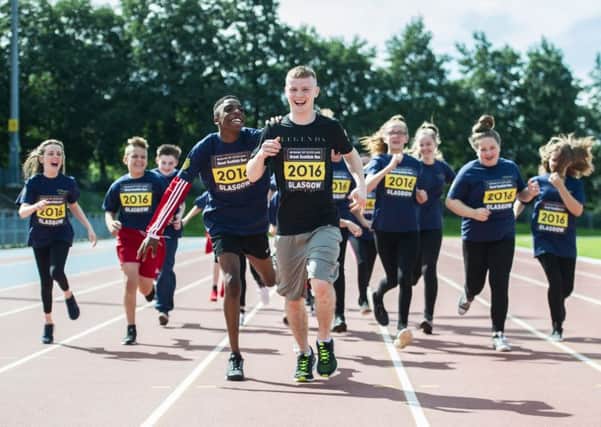 Charlie Flynn puts school children through their paces in the countdown to the Bank of 
Scotland Great Scottish Run.
