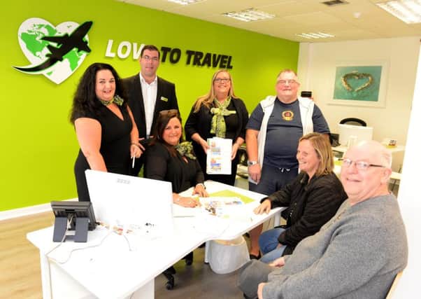 Love to Travel staff (l-r) Linda Simonini, James Grant,  Fiona Langston and owner Joanne Dooey (seated) with customers (l-r) Sandy Collins, Agnes Pollock and William Paterson  who are looking forward to their trip to Benidorm.