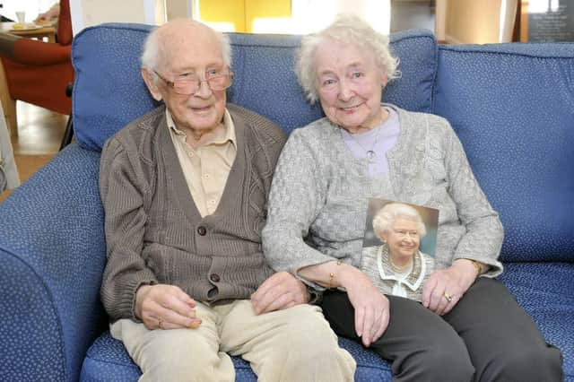 James and Iris Rudge with a message of congratulations from the Queen. Photo: Emma Mitchell