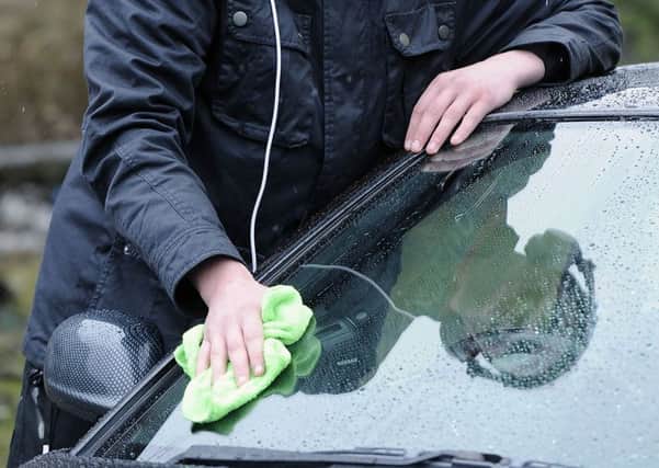 Many Scots are bucking the trend by washing their own cars