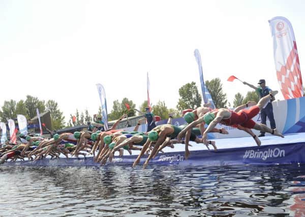 Triathletes dive into Strathclyde Loch during the Commonwealth Games