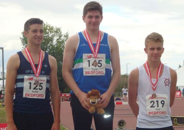 Adam Boyle (centre) on the podium with the other medallists (submitted pic)