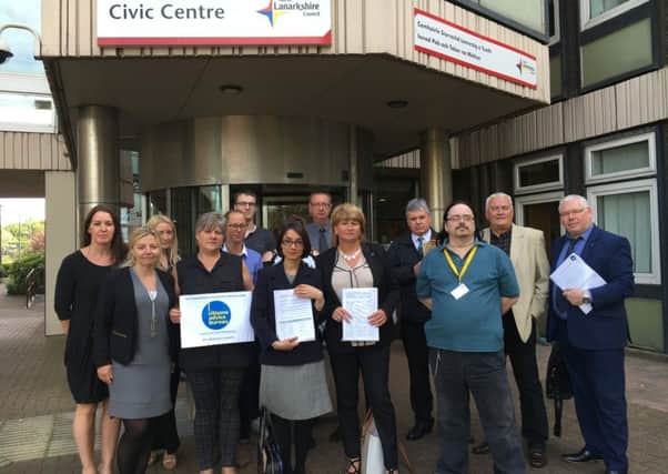 Citizens Advice Bureaux management and staff protest outside Motherwell Civic Centre as they fight to avoid having their budget cut by North Lanarkshire Council