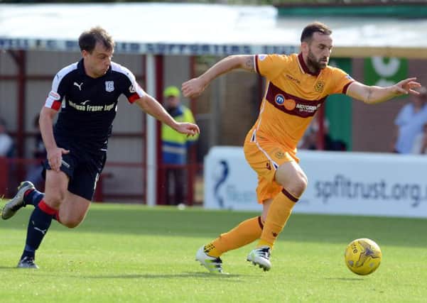 James McFadden evades Dundee's Paul McGowan in the 0-0 draw at Fir Park on August 27 (Pic by Alan Watson)