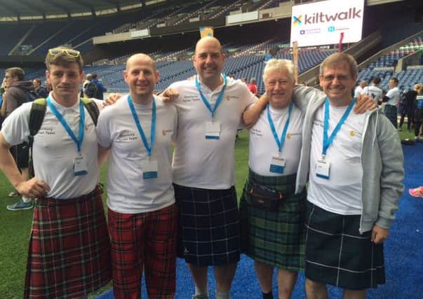 John Kennedy (right) with his colleagues at Murrayfield Stadium.