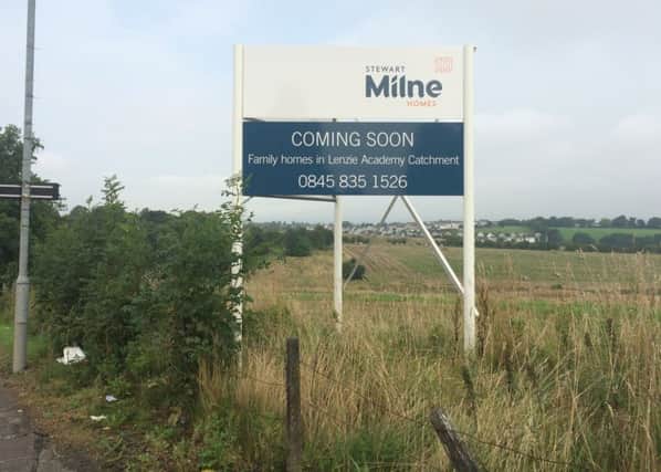 The site notice indicates the development is in the Lenzie Academy catchment area