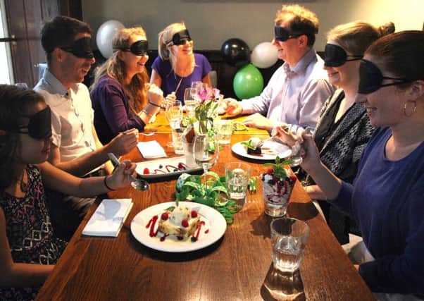 The charity is urging people to sign up to Feast your Eyes and host a dinner in the dark.