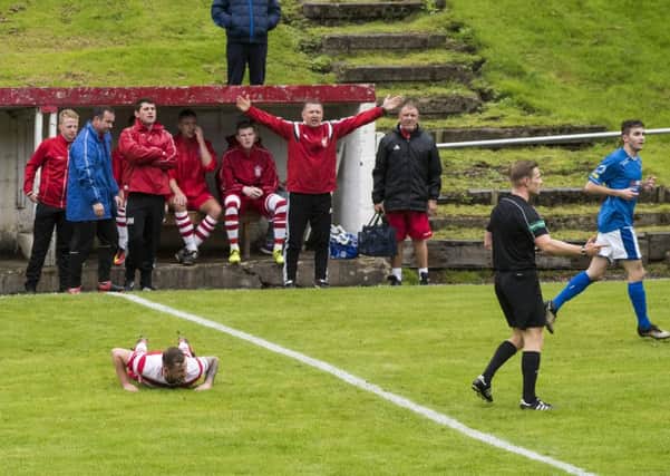 Lesmahagow manager Robert Irving cuts a frustrated figure watching his team's Scottish Junior Cup defeat to Irvine Meadow (Pic by Sarah Peters)