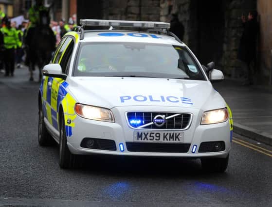 Vandals smashed the window of a police car in Kirkintilloch