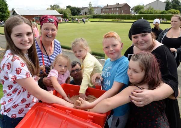 Cash raised from the Save Our Stories fun day held at Newarthill Bowling Club in August as part of the campaign to save the library could be used to kickstart a legal challenge.