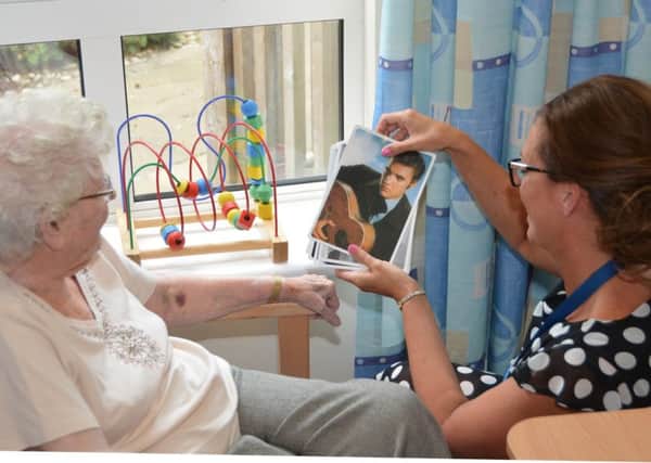 Wishaw General staff use reminiscence activities to help patients with dementia during their time in hospital.