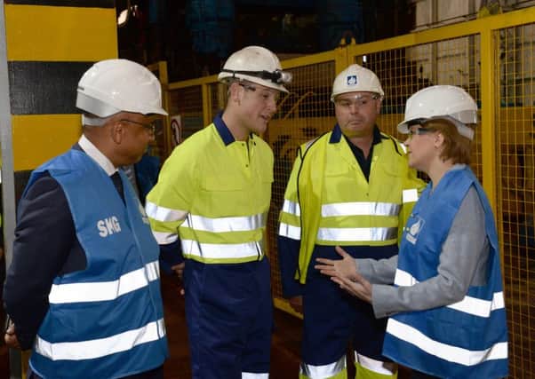 First Minister Nicola Sturgeon chats to staff at Dalzell Works.