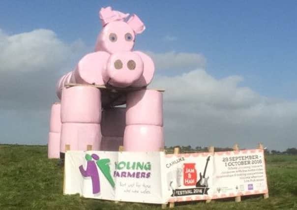 Percy, Carluke YF's giant pink pig, flags up the Jam and Ham Festival