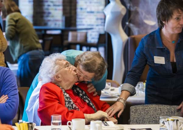 Older people get together at the monthly tea parties