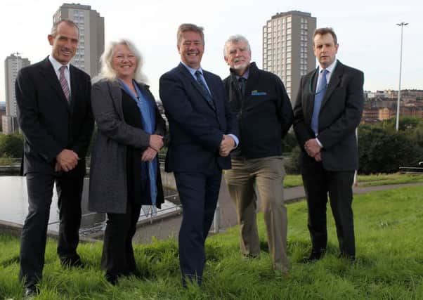 Keith Brown (centre) with 
left-right: Andrew Thin, chair of  Scottish Canals; Shiona MacPhail, Development Manager, Friends of Possilpark Greenspace; Keith Brown; Ian Ross, Chairman of Scottish Natural Heritage; David Hay, Group Manager, Glasgow City Council.