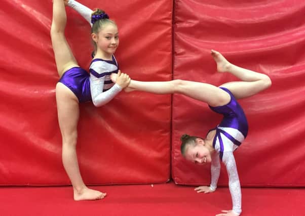 Rachel Quinn (left)  and Courtney Dunbar in their Scotland leotards are they look forward to the British finals.