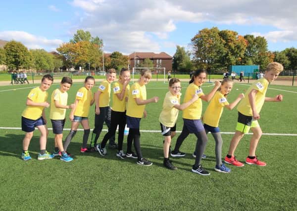 The pupils from Holy Family Primary who took part in the World 5,000m challenge