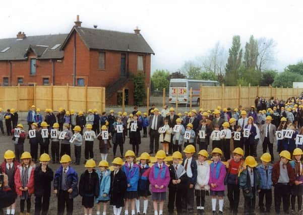 Children mark out the footprint of Motherwell Heritage Centre prior to work starting in 1995. Pic: John J McKillop.