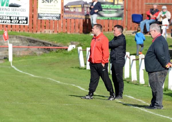 The Thorniewood management team of Andy Frame and Billy MacDonald watched their team earn a 1-1 Scottish Junior Cup second round draw at Port Glasgow last Saturday (Pic by Alan Watson)