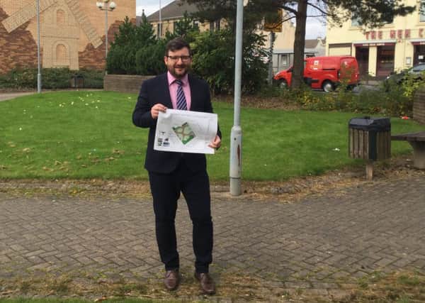 Councillor Paul Kelly with the plans for the Windmillhill Street/Camp Street improvements