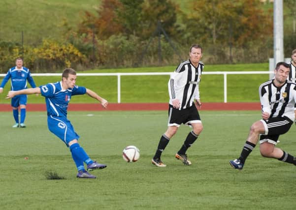 Carluke Rovers' Ian Watt unleashes a shot on goal during last Saturday's win over Deveronside (Pic by Sarah Peters)