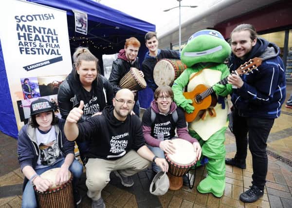 More than 200 shoppers tried learning an instrument, including Leonardo the turtle