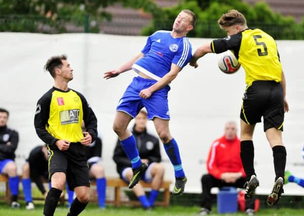 Action from last Saturday's Bellshill Athletic v Petershill cup tie (Pic by Alan Murray)
